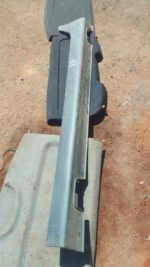 Left side skirt for Hyundai Tucson shown from left side, used condition visible in light grey background.Left