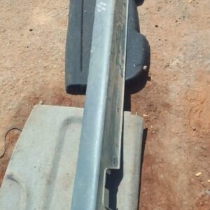 Left side skirt for Hyundai Tucson shown from left side, used condition visible in light grey background.Left