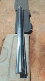 Right side skirt for Mitsubishi ASX, shown from side angle, used condition with minor scuffs visible.Right sid