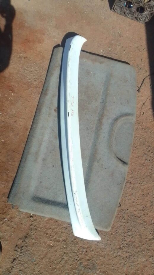 Whatsapp Image 2024-09-06 At 14.34.13 Used boot spoiler mounted on the rear edge of a Fiat Sienna, viewed from an angled side perspective.Used boot