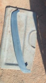 Rear angle view of a used boot spoiler designed for Opel Astra F mounted on a car's tailgate.Rear angle view o