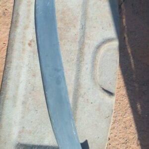 Rear angle view of a used boot spoiler designed for Opel Astra F mounted on a car's tailgate.Rear angle view o