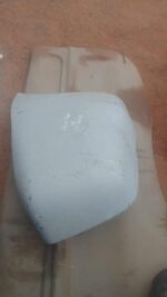 Right rear bumper corner for Chery Tiggo shown from rear angle, used condition visible.Right rear bumper corne
