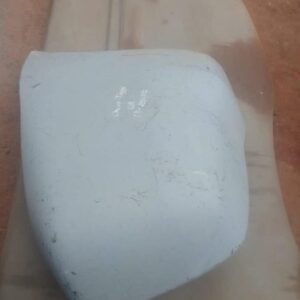 Right rear bumper corner for Chery Tiggo shown from rear angle, used condition visible.Right rear bumper corne