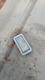 Used roof light viewed from top angle showing clear and red lens with mounting points on the base.Used roof li