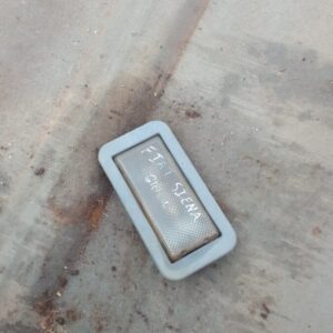 Used roof light viewed from top angle showing clear and red lens with mounting points on the base.Used roof li