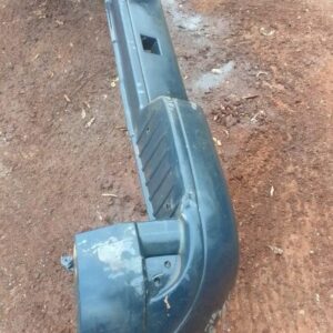Rear view of used rear bumper for a Nissan NP200, showing mounting points and overall condition.Rear view of u