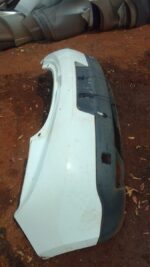 Rear view of a used Renault Megane rear bumper showing mounting points and surface condition.Rear view of a us