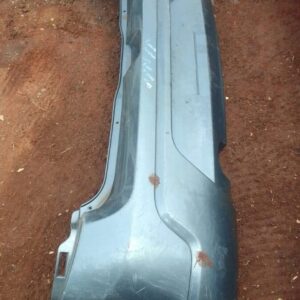 Rear view of a used Renault Sandero rear bumper displayed against a plain background.Rear view of a used Renau