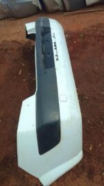 Rear view of used Renault Megane rear bumper showing mounting points and curves on a white background.Rear vie