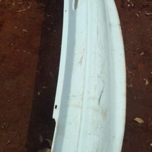 Rear view of a used rear bumper for a 1996 Opel Astra, showing attachment points and surface condition.Rear vi