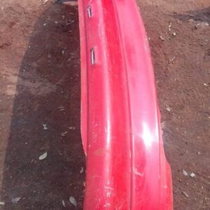 Rear view of a used Opel Kadett car bumper, showing minor wear and mounting points.Rear view of a used Opel Ka