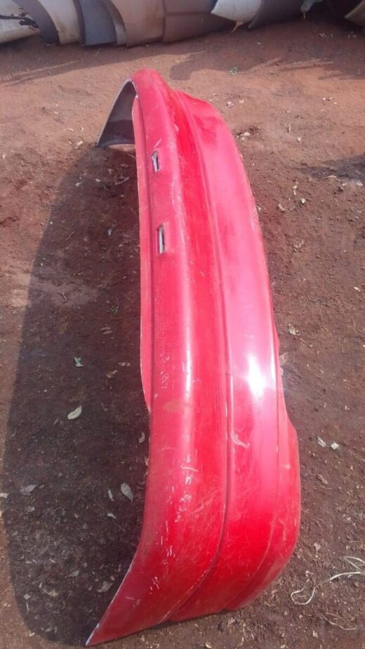 1995 Opel Kadett Rear Bumper - Used Rear view of a used Opel Kadett car bumper, showing minor wear and mounting points.Rear view of a used Opel Ka
