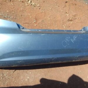 Rear view of a used Chevrolet Aveo rear bumper showing intact mounting points and minor wear.Rear view of a us