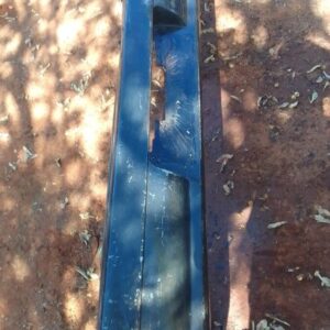 Rear view of used rear bumper for a 1996 Mazda 323 displayed on a white background.Rear view of used rear bump