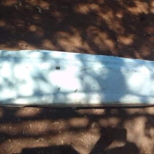 Used rear bumper viewed from the back, showing attachment points and slight wear on a 2000 Opel Corsa.Used rea