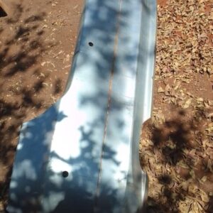 Rear view of a used BMW E90 rear bumper showing mounting points and light cutouts.Rear view of a used BMW E90