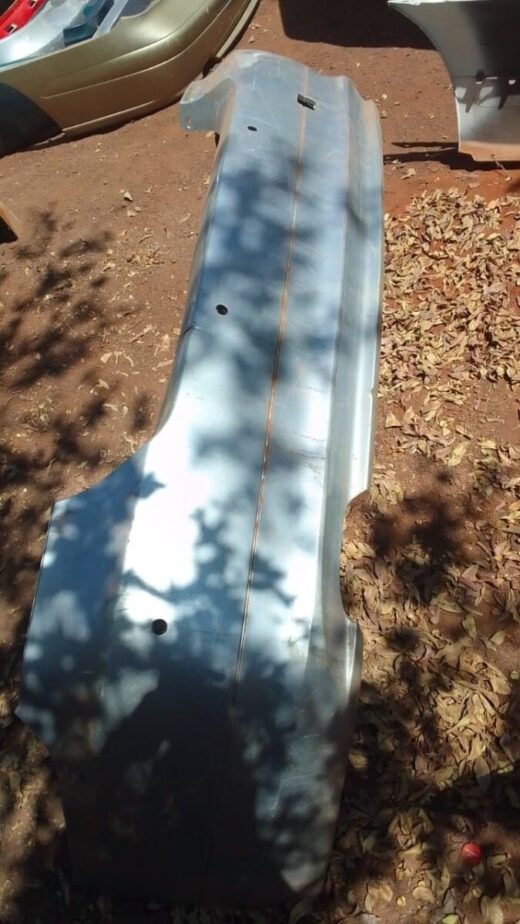 2011 Bmw E90 Rear Bumper - Used Rear view of a used BMW E90 rear bumper showing mounting points and light cutouts.Rear view of a used BMW E90