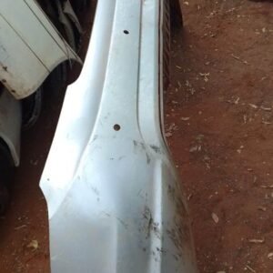 Rear bumper showing back view, used condition with mounting points and slight wear visible.Rear bumper showing