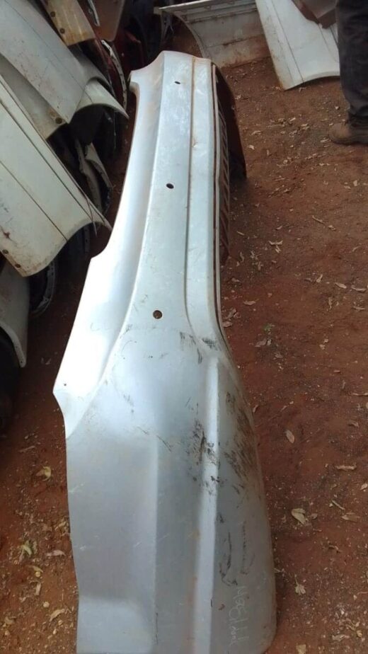 2014 Mercedes A216 Rear Bumper - Used Rear bumper showing back view, used condition with mounting points and slight wear visible.Rear bumper showing