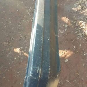 Rear view of a used rear bumper for a 1989 Honda Ballade, showing mounting points and surface condition.Rear v