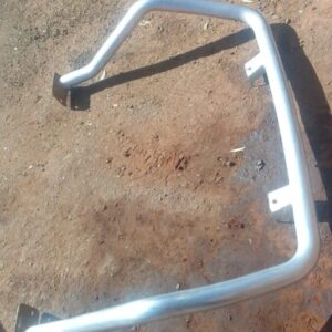 Front angled view of a used roll bar for a 2013 Nissan NP200, showing tubular metal construction and mounting